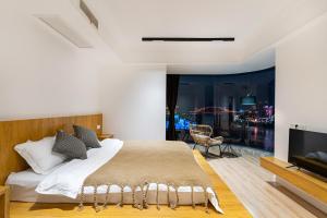 Katil atau katil-katil dalam bilik di 重庆暖余江景民宿 Chongqing Nuanyu River View Hotel