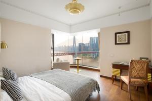 Katil atau katil-katil dalam bilik di 重庆暖余江景民宿 Chongqing Nuanyu River View Hotel