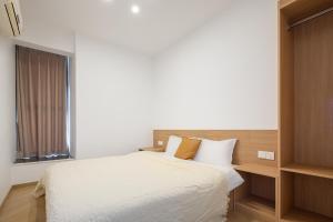 Katil atau katil-katil dalam bilik di 重庆暖余江景民宿 Chongqing Nuanyu River View Hotel