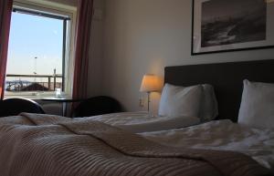 Voodi või voodid majutusasutuse Hotell Villa Solviken toas