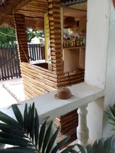 a wooden building with a bar on a patio at Beach house villa in Kokrobite