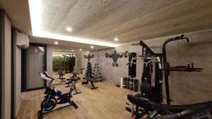 a gym with several tread machines in a room at Elite Luxury Suite - City 3 in Alanya