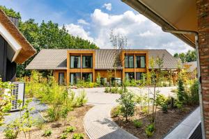 Κήπος έξω από το Veluwe Villa met Privé Binnenzwembad & Sauna | 8 personen