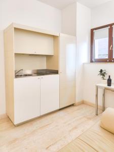 Kuchyň nebo kuchyňský kout v ubytování Oidu - Cagliari Suites