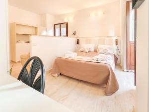Postel nebo postele na pokoji v ubytování Oidu - Cagliari Suites