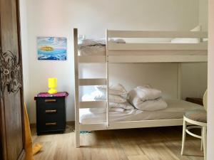 a bedroom with two bunk beds with pillows at La Vigie in Crozon