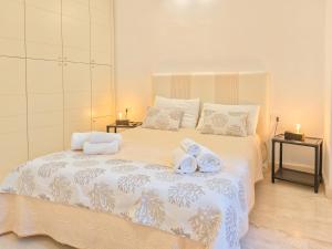 Postel nebo postele na pokoji v ubytování Oidu - Cagliari Suites