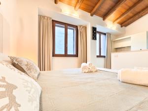 Postel nebo postele na pokoji v ubytování Oidu - Cagliari Suites