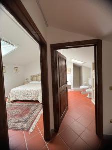 Katil atau katil-katil dalam bilik di Appartamento in fattoria#1