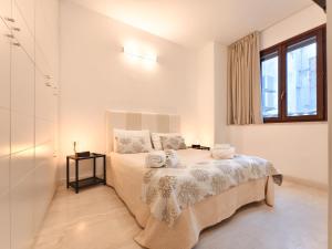 Postel nebo postele na pokoji v ubytování Oidu - Cagliari Suites