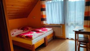Postel nebo postele na pokoji v ubytování Nad Zalewem