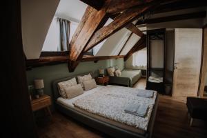 A bed or beds in a room at Mushrooms Malomszállás