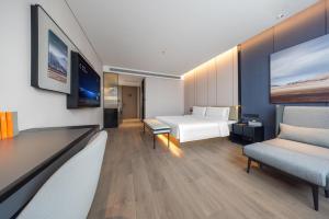 Postel nebo postele na pokoji v ubytování Atour Hotel Yinchuan Lijing Lake Jiefang Road