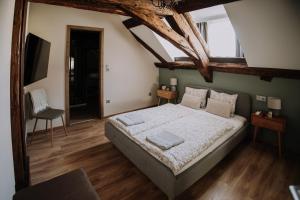 A bed or beds in a room at Mushrooms Malomszállás