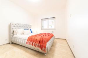 Una cama o camas en una habitación de Villa Geranios