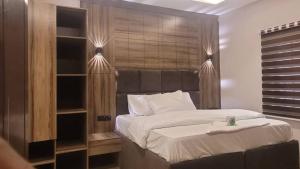 Ένα ή περισσότερα κρεβάτια σε δωμάτιο στο Bayview Apartment
