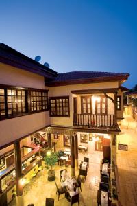 an indoor patio of a house at night at Cicerone Lodge Hotel in Antalya