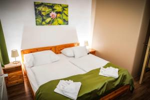 Posteľ alebo postele v izbe v ubytovaní Land-Plan Hotel