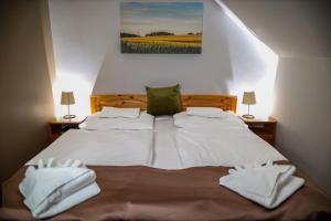 Posteľ alebo postele v izbe v ubytovaní Land-Plan Hotel