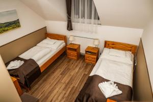 Posteľ alebo postele v izbe v ubytovaní Land-Plan Hotel