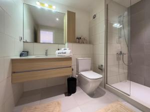 a bathroom with a sink and a toilet and a shower at Lagoon chalet in marina views 3 bedrooms perfect view exm68 in El Alamein +7 photos