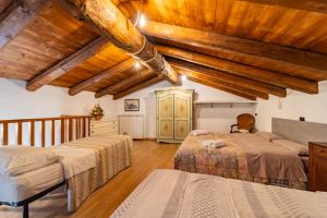 Katil atau katil-katil dalam bilik di Rifugio la Rocca