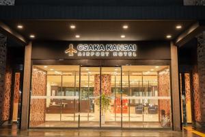 a store front of a building with a sign on it at Osaka Kansai Airport Hotel Kansai Airport 2 station in Izumi-Sano