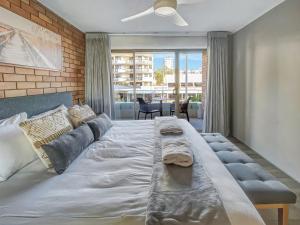 Postel nebo postele na pokoji v ubytování The Block Mooloolaba