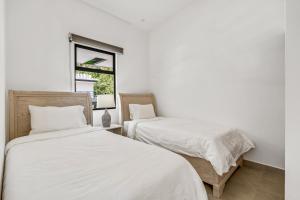 Postelja oz. postelje v sobi nastanitve 8-min Walk to Beach with Pool & Golf