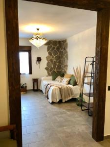 Posteľ alebo postele v izbe v ubytovaní Casa Rural LA BRETONA