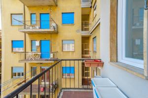 a balcony of a building with blue windows at Milano Centro Duomo-Wifi-Metro in Milan