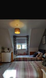 Katil atau katil-katil dalam bilik di Cozy Holiday Home in the Scenic Glen of Aherlow
