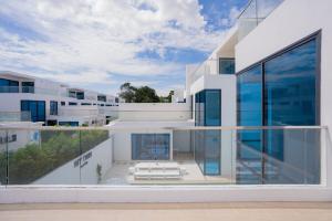 a view of a house with glass walls and ceilings at My Havana, pool villa in Ban Nong Pru