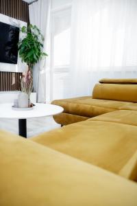 Posezení v ubytování Moderný 3i byt s balkónom