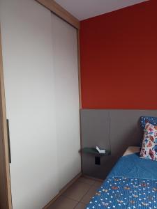 Ένα ή περισσότερα κρεβάτια σε δωμάτιο στο Apartamento Marilda +4 φωτογραφίες