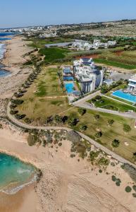 an aerial view of a resort on the beach at Seaview Luxury Villa Fortuna in Ayia Napa