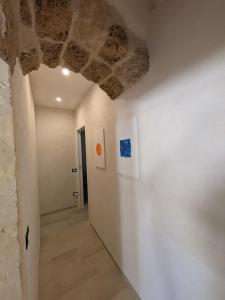a room with a stone ceiling and a hallway at Casa Ellera in Noto +31 photos