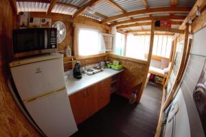 an overhead view of a kitchen in a tiny house at Karavan AIDA in Živogošće