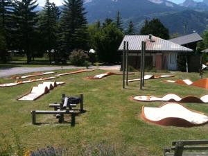 a bunch of skateboards and ramps in a field at CHALET MONTAGNE CLASSÉ 3 ETOILES ALPES QUEYRAs in Guillestre +4 photos