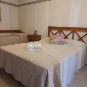 Postel nebo postele na pokoji v ubytování Aparthotel Agave