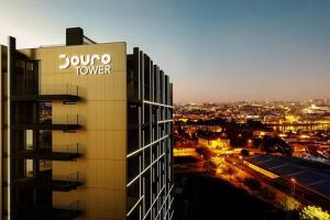 a building with a sign on the side of it at New Douro 908 with pool shared and parking in Vila Nova de Gaia
