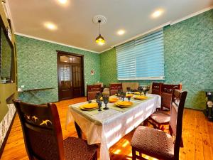 a dining room with a table and chairs at Gabala Garden Harmony in Gabala