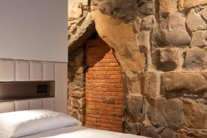 Postel nebo postele na pokoji v ubytování Le Torri Suites