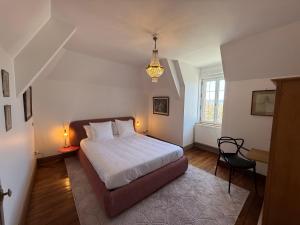 Postel nebo postele na pokoji v ubytování Château de Ligny