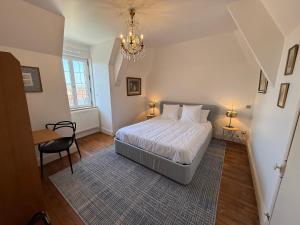 Postel nebo postele na pokoji v ubytování Château de Ligny