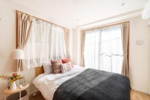 Uma cama ou camas num quarto em 121T MINE HOME野方 nogata MH野方 98m貸切 野方駅から徒歩1分 新宿まで6駅17分 寝室4 広々一軒家 リノベーション