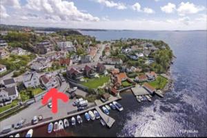 an aerial view of a town with boats in the water at Local small apartment near the beach in Kristiansand