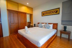 Katil atau katil-katil dalam bilik di Windy House By Serenity Sea House