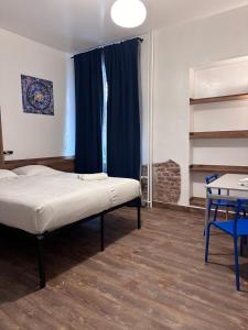 Postel nebo postele na pokoji v ubytování Gallery Hotel SIS