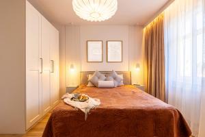 a bedroom with a large bed with a large window at Comfy Aparts Św Mikołaja in Głogów +59 photos